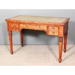 A 19th Century Continental mahogany rectangular writing table, fitted five drawers, on leaf carved