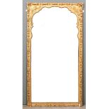 A 19th Century gilt framed wall mirror decorated in bold relief with leafage and leaf paterae within