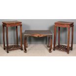 A pair of Chinese rosewood rectangular occasional tables, the tops with rounded edges and carved