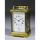 A late 19th/early 20th Century French carriage clock, the white enamelled dial with Roman numerals