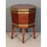 A George III mahogany and brass bound octagonal two-handled wine cooler on stand with square splayed