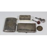 A German silvery metal rectangular card case of plain design, the circular clasp set with a cabochon