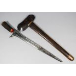 A 19th Century South East Asian "Moro" kris, the 17.5ins watered steel blade with hair covered