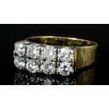 A modern 18k gold mounted all diamond set ring, the face set with eight brilliant cut stones each