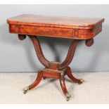 A late Georgian mahogany rectangular card table, the baize lined folding top with rounded front