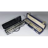 A Boosey & Hawkes "Cooper" pattern plated flute, 26ins, and an "Odyssey" flute, 26.25ins, both cased