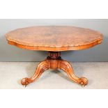 A Victorian figured walnut circular breakfast table of shaped outline, the top with quartered