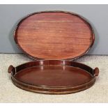 A late 18th/early 19th Century Dutch brass bound mahogany oval two-handled tray, 23ins x 15ins,