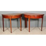 Two George III mahogany semi-circular tea tables each inlaid with boxwood stringings, on square