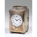 An Edward VII plain silver cased travelling timepiece, the 1.5ins diameter white enamelled dial with
