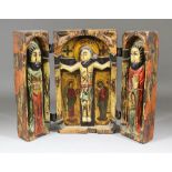 A 20th Century Spanish wood triptych, deeply carved, painted and gilded with central image of the