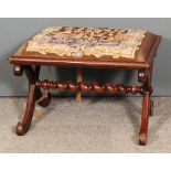 An early Victorian walnut rectangular stool, the seat upholstered in tapestry, on X-pattern end