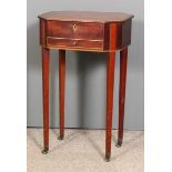 A George III mahogany octagonal work table inlaid with boxwood stringings, the crossbanded lifting