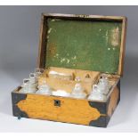 A late 19th Century oak cased apothecary's box, the fitted interior with glass bottles and ceramic