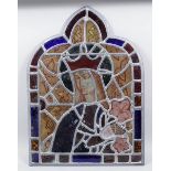 A Victorian composite stained glass panel of "Gothic" outline - Virgin Mary and lilies, 23.5ins x