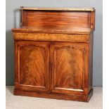 A George IV mahogany chiffonier, the low back fitted shelf with turned supports, fitted one frieze