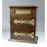 A late Victorian oak and brass mounted letter box, the hinges of Gothic design, 10ins wide x 7.25ins