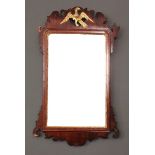 A mahogany rectangular wall mirror of George II design, the shaped cresting with gilt Ho-Ho bird