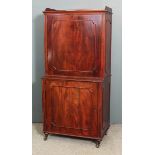 A 19th Century Continental figured mahogany Secretaire cabinet with flush panelled sides and