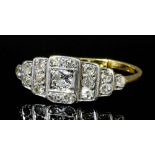 An Edwardian 18ct gold mounted all diamond set dress ring, the face pave set with seventeen small