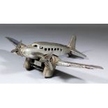 A 1930s chromed tinplate clockwork model aircraft possibly by Gunthermann or Arnold embossed and