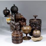 A small collection of hardwood snuff and tobacco jars and lids, including - example carved with