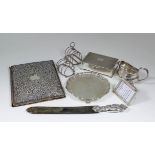 A late Victorian silver mounted leather rectangular blotter, the cover boldly embossed with