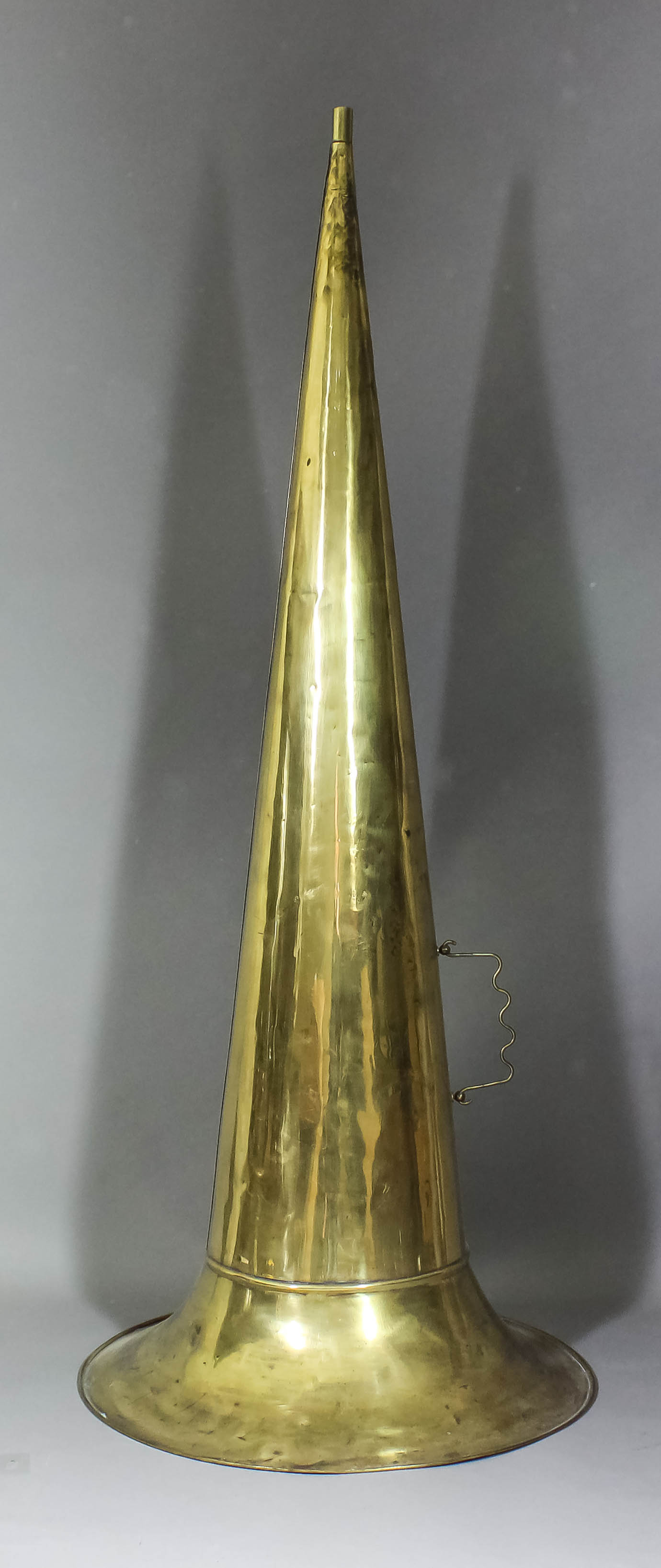 A large brass "Witches Hat" pattern phonograph horn, 43ins overall