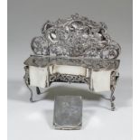 An Edward VII silver jewellery box modelled in the form of a break-front sideboard, the shaped