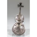 An early 20th Century Continental silver novelty miniature box modelled as a cello, embossed with