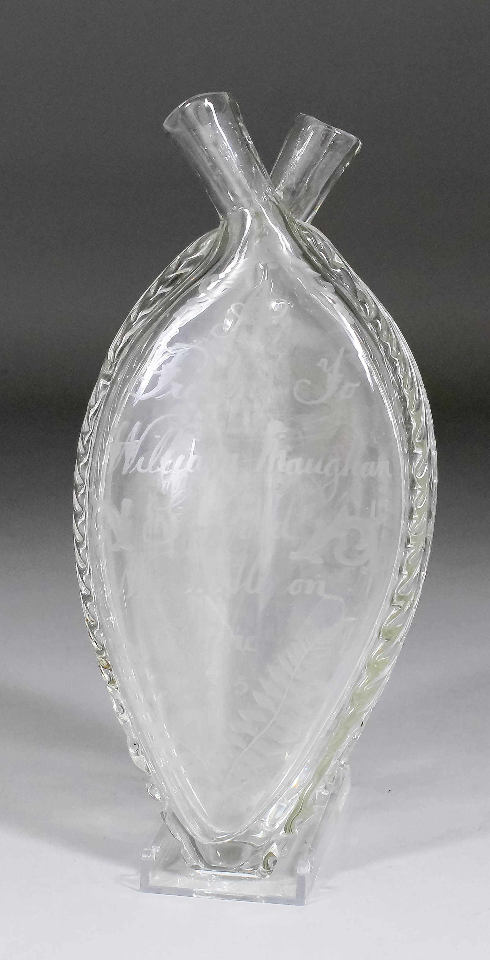 A late 19th Century English glass flask of flattened form with twin pouring spouts, engraved "A