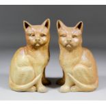 An unusual pair of A.G. Hopkins of Lambeth stoneware models of seated cats, 8.5ins high, dated 1928