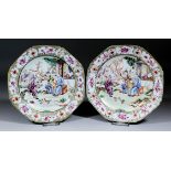 A pair of Chinese porcelain octagonal plates enamelled in colours and gilt with a family group