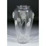 A late 19th/early 20th Century clear glass vase with trailed prunts, 12ins high
