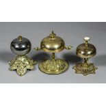 Three cast and plated metal table bells, 4.5ins to 5.5ins high