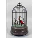 A 1960s German "Bird in a Bronzed Cage" - Two bird automaton with red and yellow feathers, one