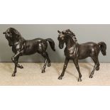 20th Century School - Two dark brown patinated bronze figures of horses, each 23ins high