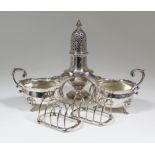 A pair of late Victorian silver oval sauce boats of Georgian design with shaped rims, leaf capped