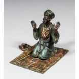 A late 19th/early 20th Century Austrian cold painted bronze figure by Franz Bergman of a kneeling