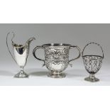 A George III silver helmet pattern cream jug with bead mounts to rim and part fluted body, high