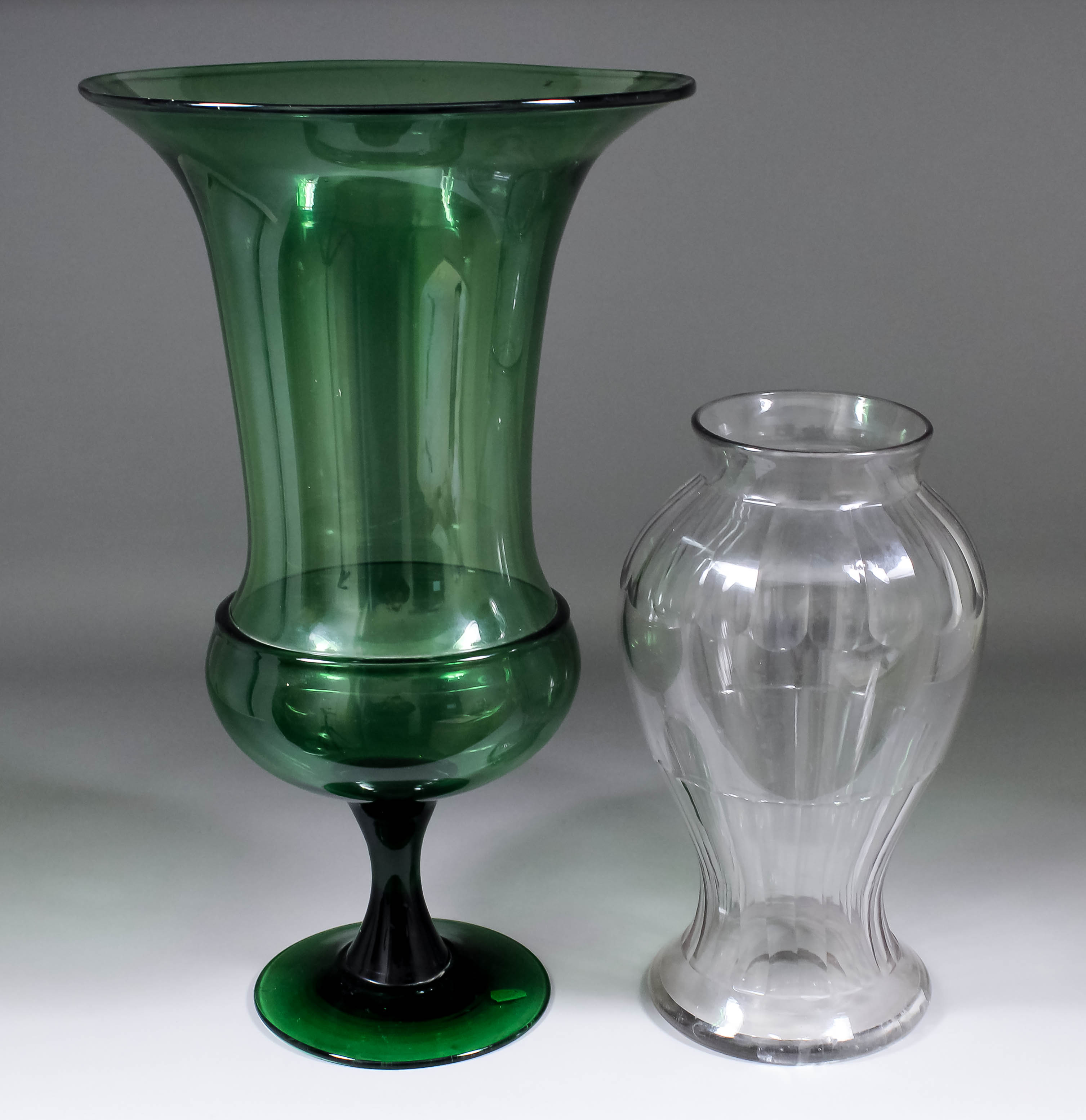 A 19th Century green glass vase of "Campana" form, 13.75ins diameter x 23.25ins high, and a 19th