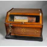 A late 19th Century American "Concert Roller Organ" playing on twenty keys and to take 6.25ins