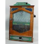 A 1950s Bradley's oak cased penny-in-the-slot gaming machine - "The Challenger", the aluminium front