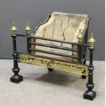 A late 19th/early 20th Century black painted cast iron and brass mounted fire grate, 29ins wide x