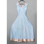 A lady's cream silk wedding skirt and jacket, a lady's blue cloth dress and a small quantity of