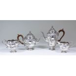 An Edward VII silver four piece tea and coffee service in the manner of Paul De Lamerie (1688-1751),