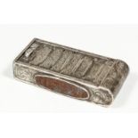 A Victorian silver rectangular vesta case modelled in the form of a tambour fronted cabinet and