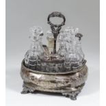 A Victorian silver rectangular cruet embossed with flowers and leaf scroll ornament, and with leaf