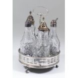 A George III silver circular cruet, the pierced rim with bead mounts and central leaf capped loop