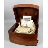 A 1950s Pye "Black Box" four speed record player in mahogany bow-fronted case, 17ins wide x 14ins